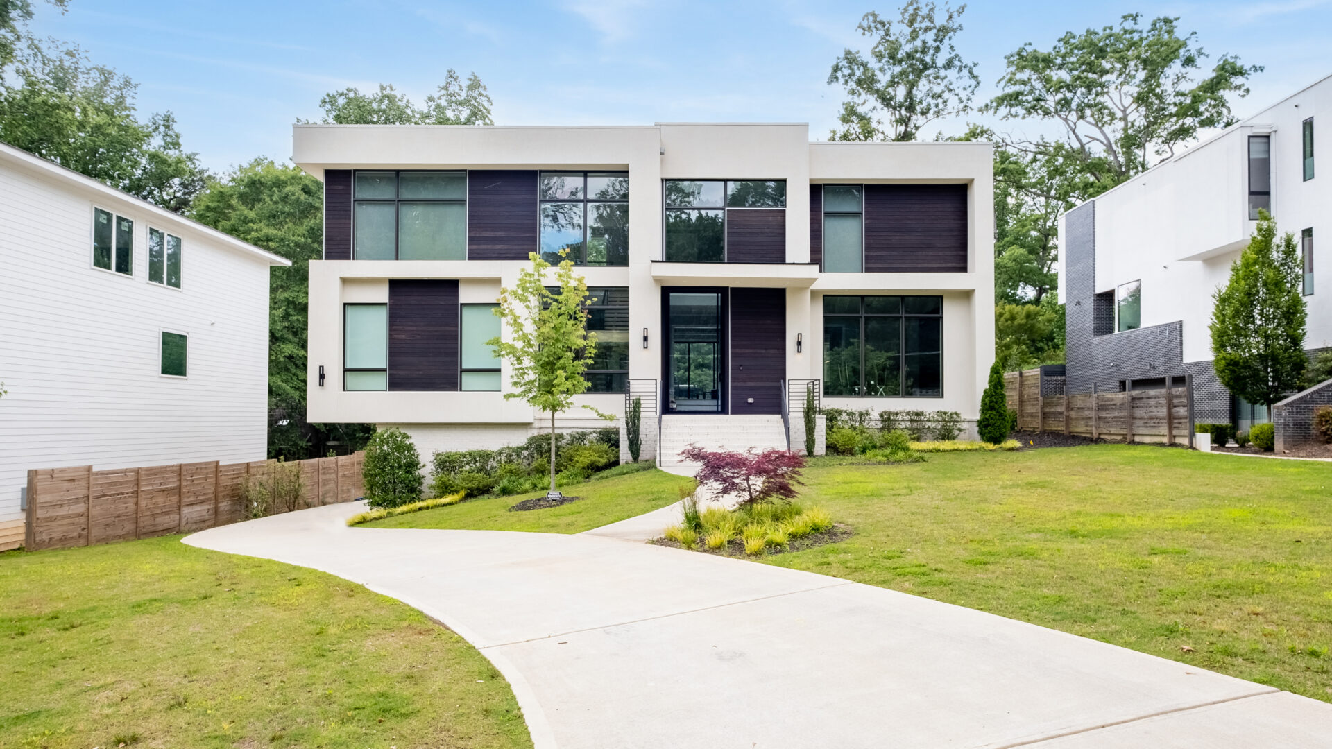 A large modern home with lots of windows.